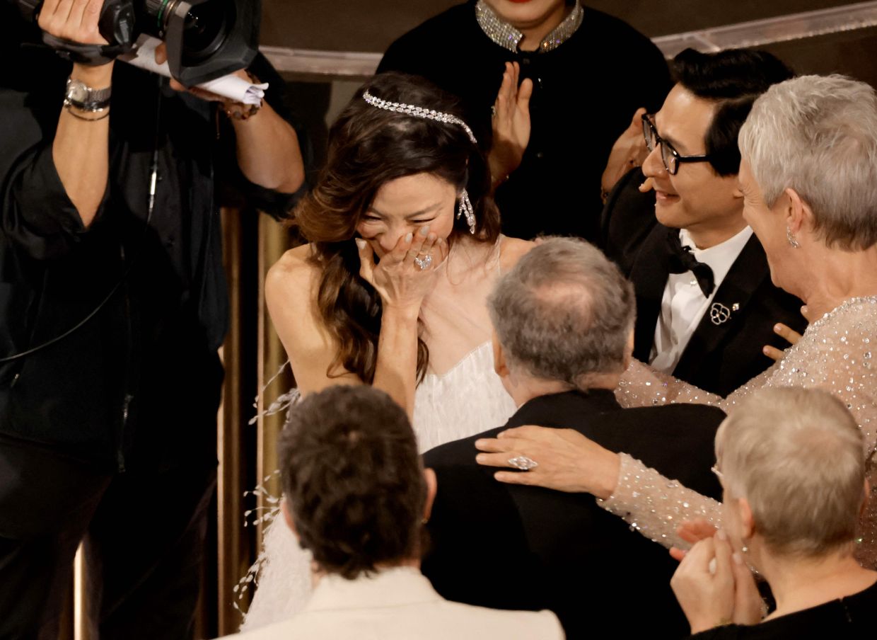 Michelle Yeoh reacts as she is named Best Actress at the Oscars. Photo: AFP