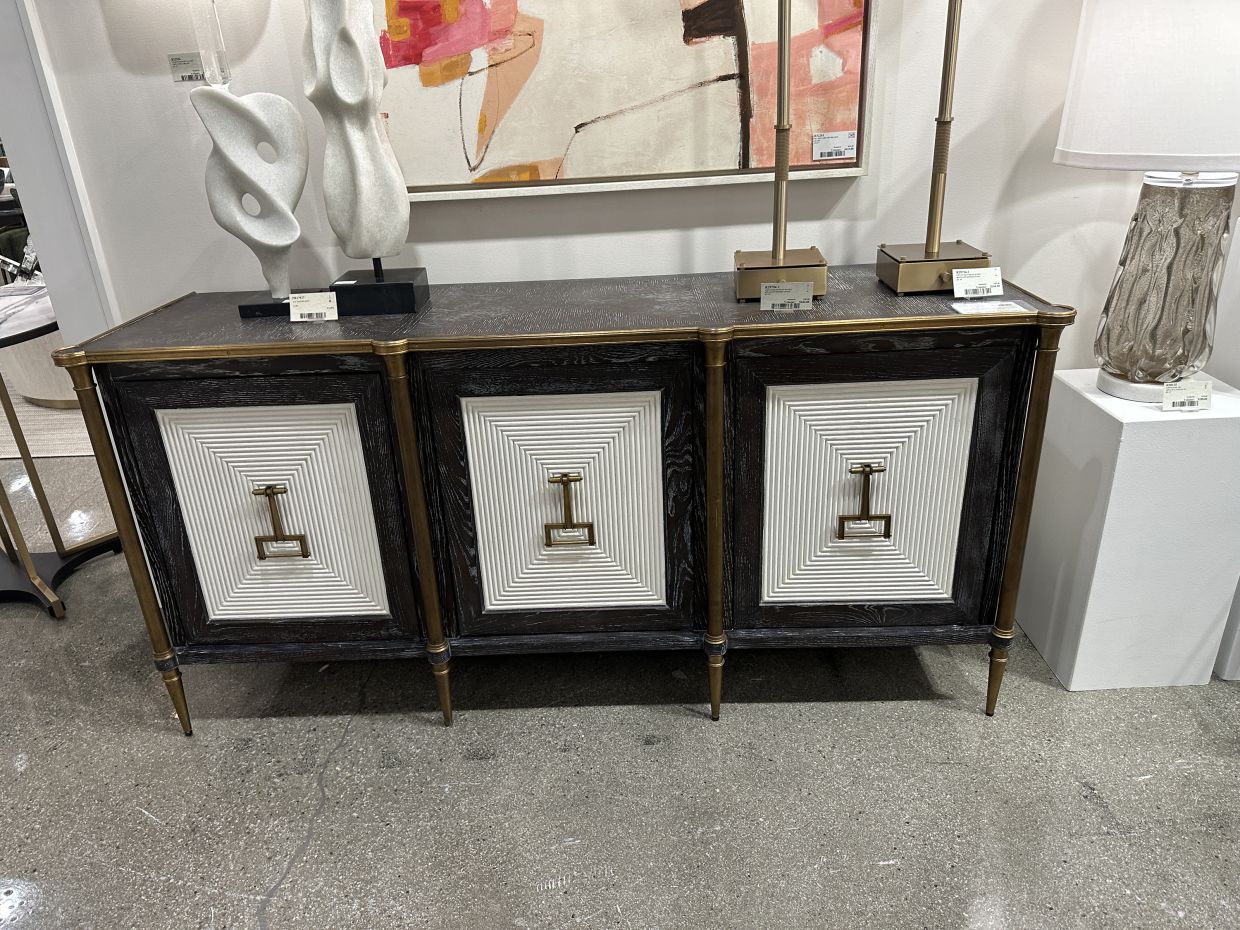 A classic sideboard featuring brass handle hardware. 