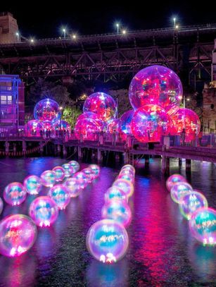 A photo stop at the 'Ephemeral Oceanic' light installation at Walsh Bay. – Destination NSW