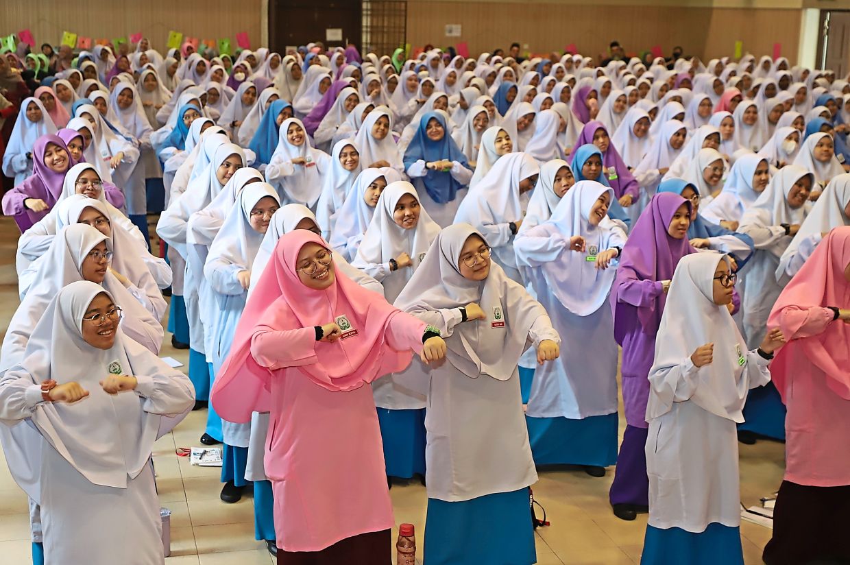 Dancing queens: Students starting their morning assembly with a series of dance routines at SMK Perempuan Al-Mashoor in Jalan Sultan Ahmad Shah, George Town.