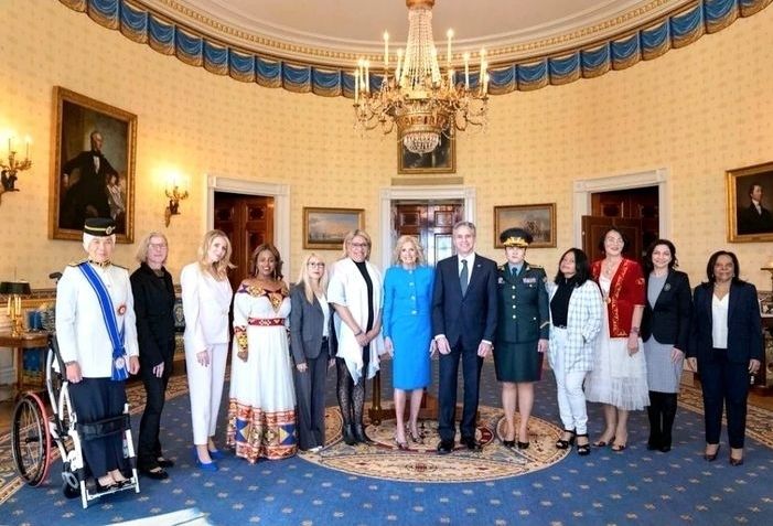 Ras Adiba (far left) with Biden (centre, in blue)  and the other IWOC awardees.