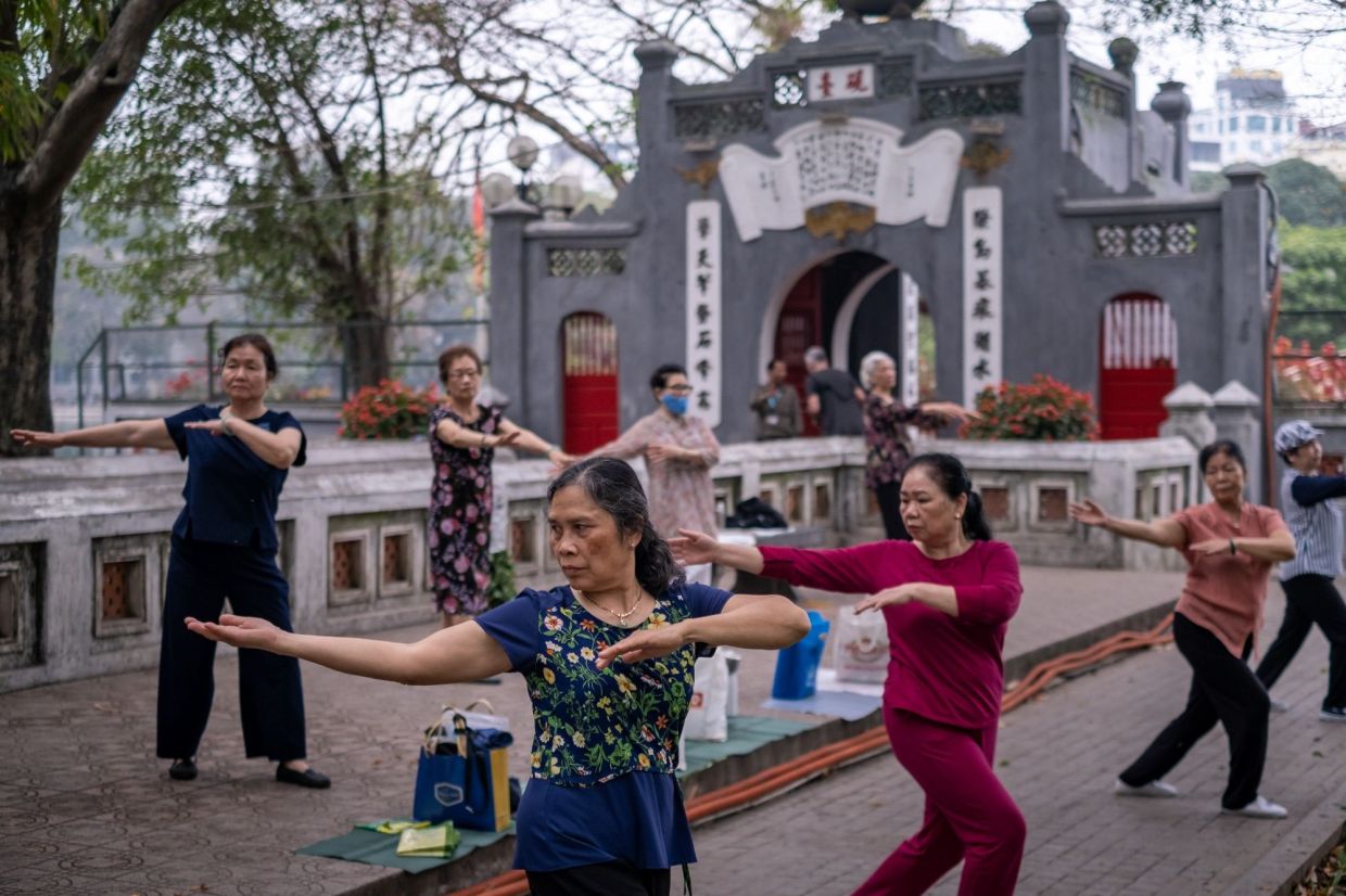 Women exercise near Hoan Kiem lake in Hanoi, Vietnam, on Tuesday, March 21, 2023. Vietnam is scheduled to release it's annual gross domestic product (GDP) figures on March 29. - Bloomberg