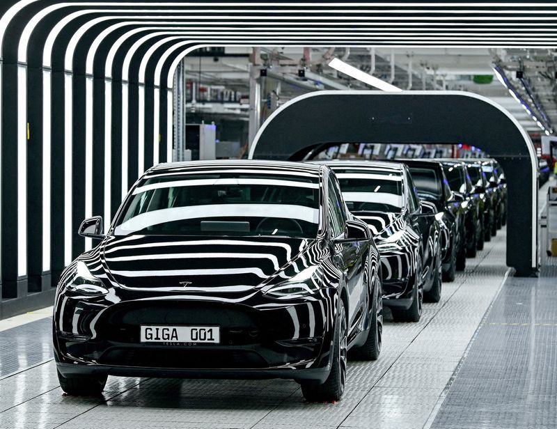 FILE PHOTO Model Y cars are pictured during the opening ceremony of the new Tesla Gigafactory for electric cars in Gruenheide Germany March 22 2022. Patrick PleulPool via REUTERSFile Photo