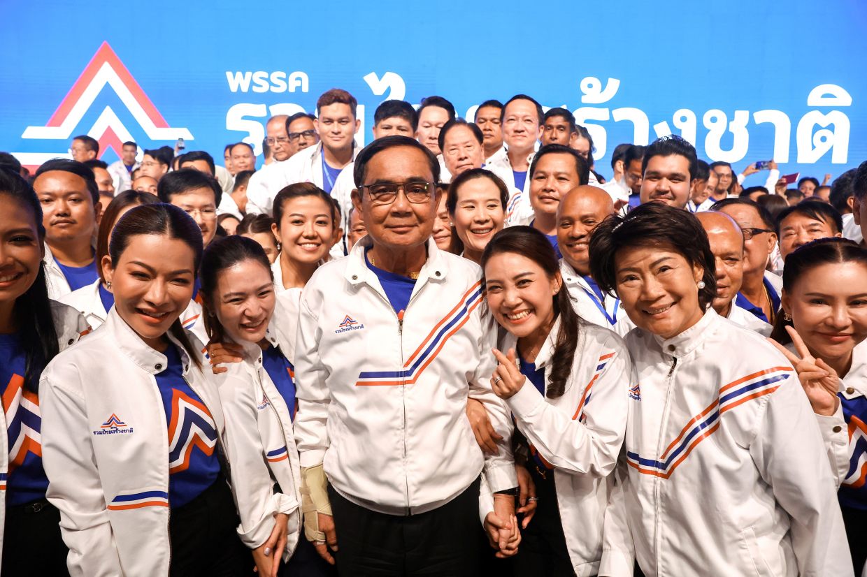 Thailand's Prime Minister Prayuth Chan-ocha, as the PM candidate from the United Thai Nation Party (Ruam Thai Sang Chart Party), poses with party's members during an event to unveil the party's candidates list and campaing for the upcoming election, in Bangkok, Thailand, Saturday, March 25, 2023. - Reuters