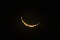 Planet of love Venus sidles up to glowing crescent moon in Singapore night sky