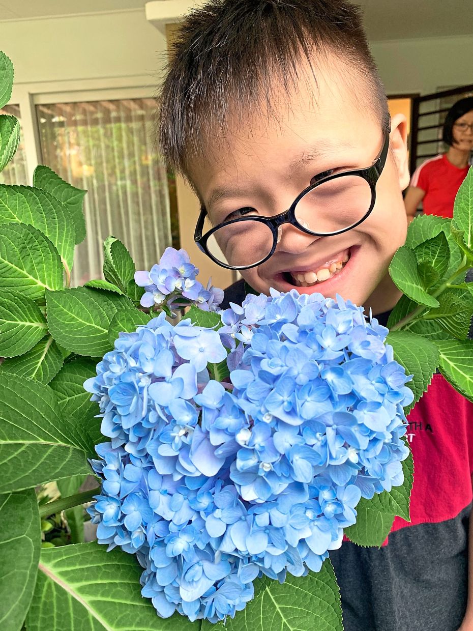 Wei Xing checks on his garden almost as soon as he gets home from schools.