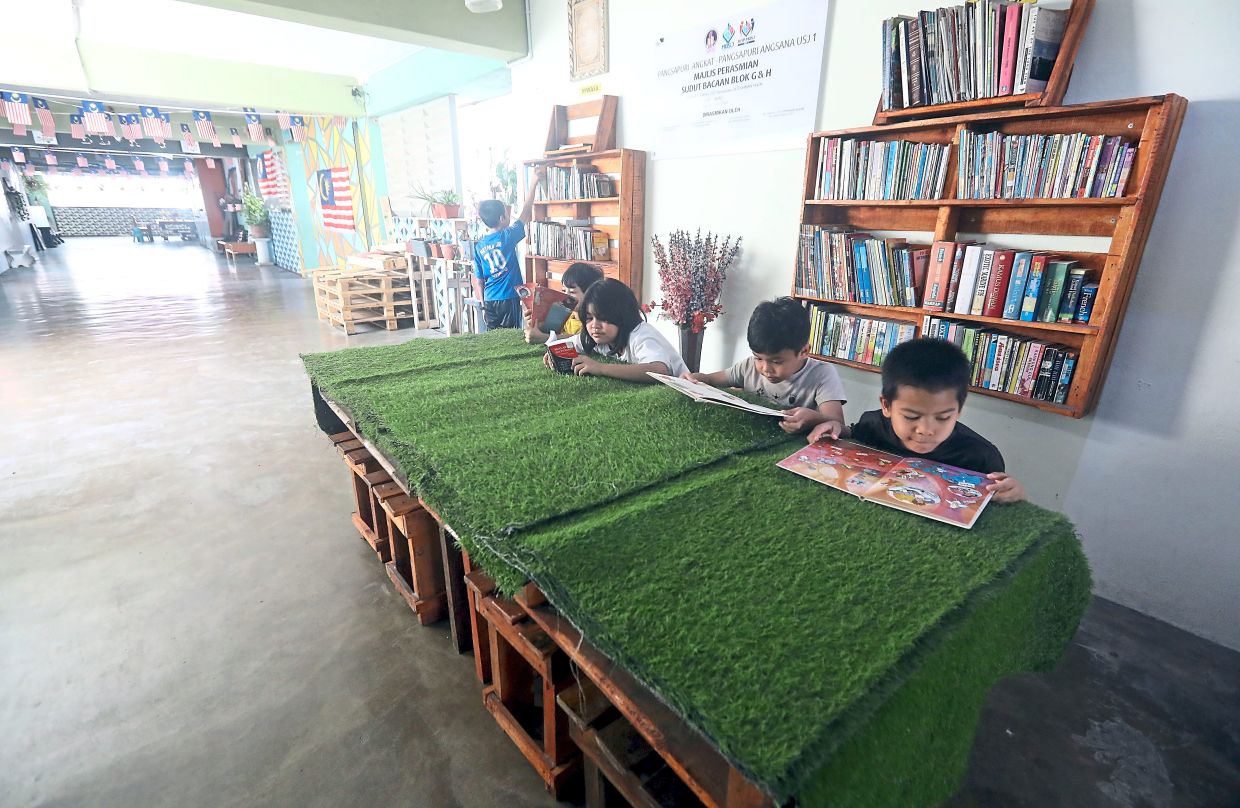 Children at Pangsapuri Angsana are now able to spend quality time at the community library. — Photos: AZLINA ABDULLAH and RAJA FAISAL HISHAN/The Star