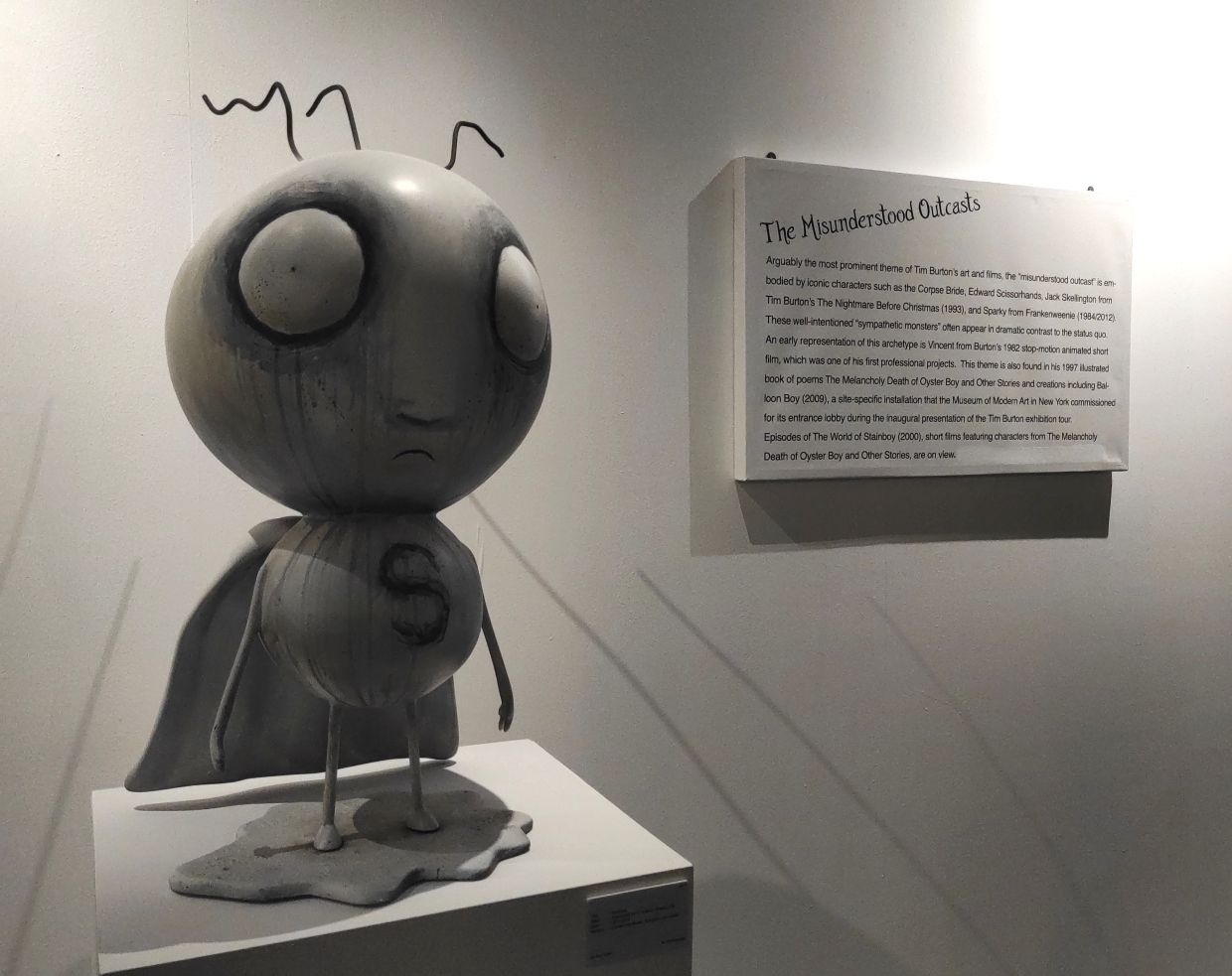 In the section on misunderstood outcasts at the The World Of Tim Burton, you can find the character Stainboy that first appeared in the 1997 poetry book The Melancholy Death of Oyster Boy And Other Stories, created and illustrated by Tim Burton.