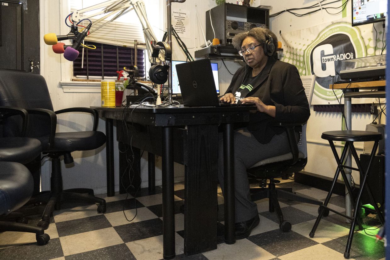 Tosto editing her Grief Journeys programme at G-Town Radio. 