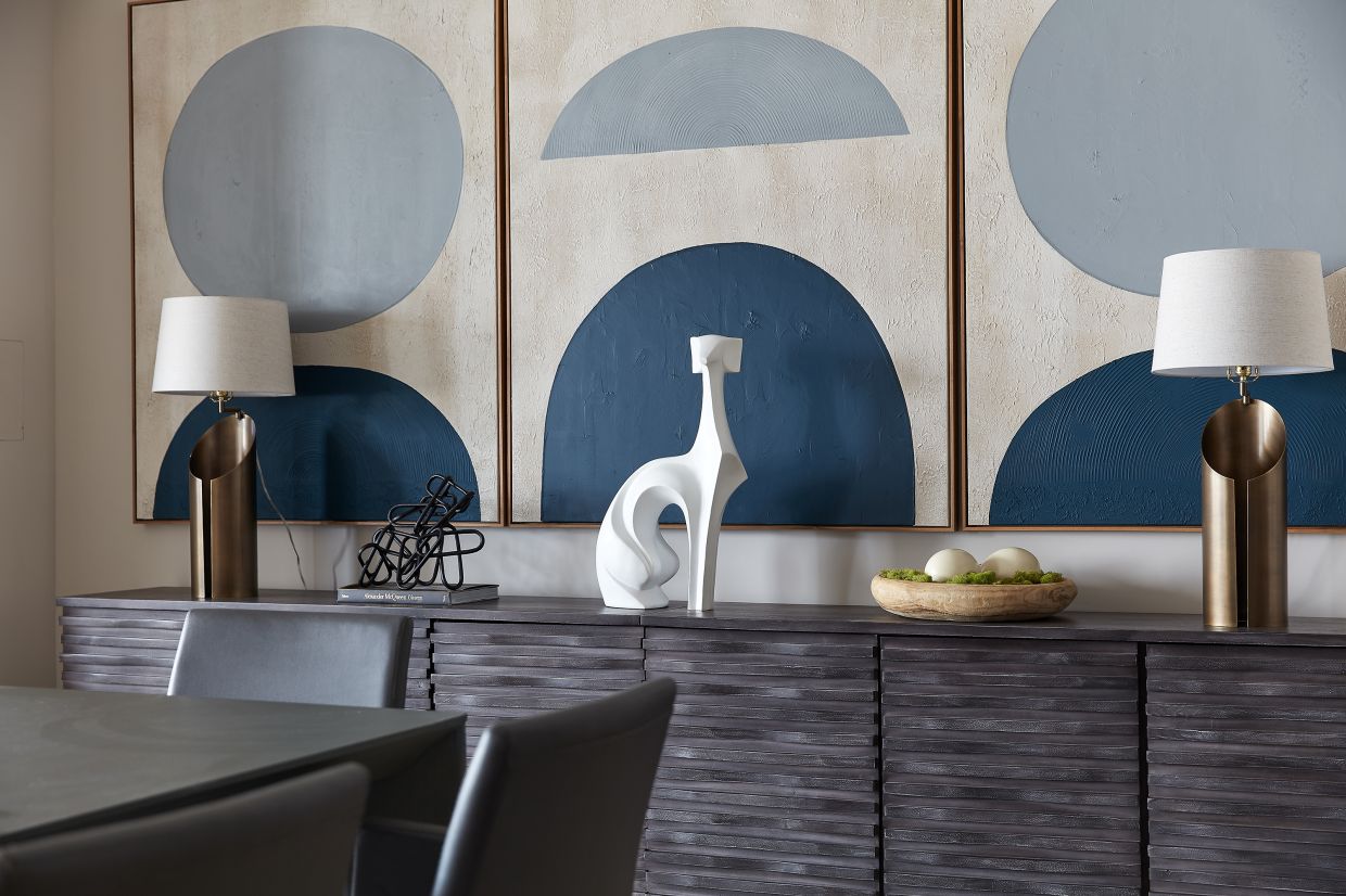 Shades of blue create an interesting color triptych in a dining room space. 