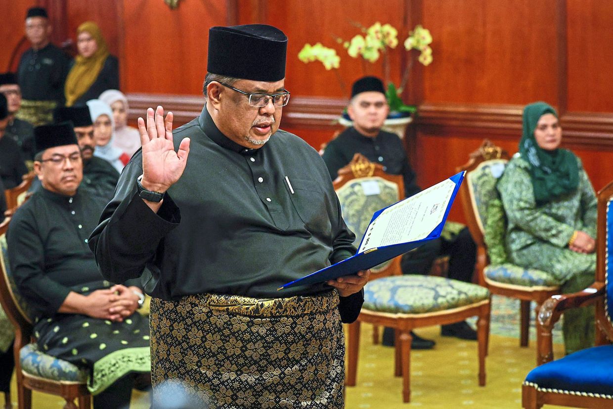 It’s official: Ab Rauf taking his oath as the 13th Chief Minister of Melaka at the office of the Yang di-Pertua Negeri in Ayer Keroh. — Bernama