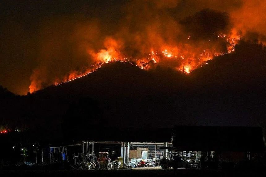 Thai firefighters battle forest blaze; pollution worsens as more than two million people fall ill - Vimarsana News