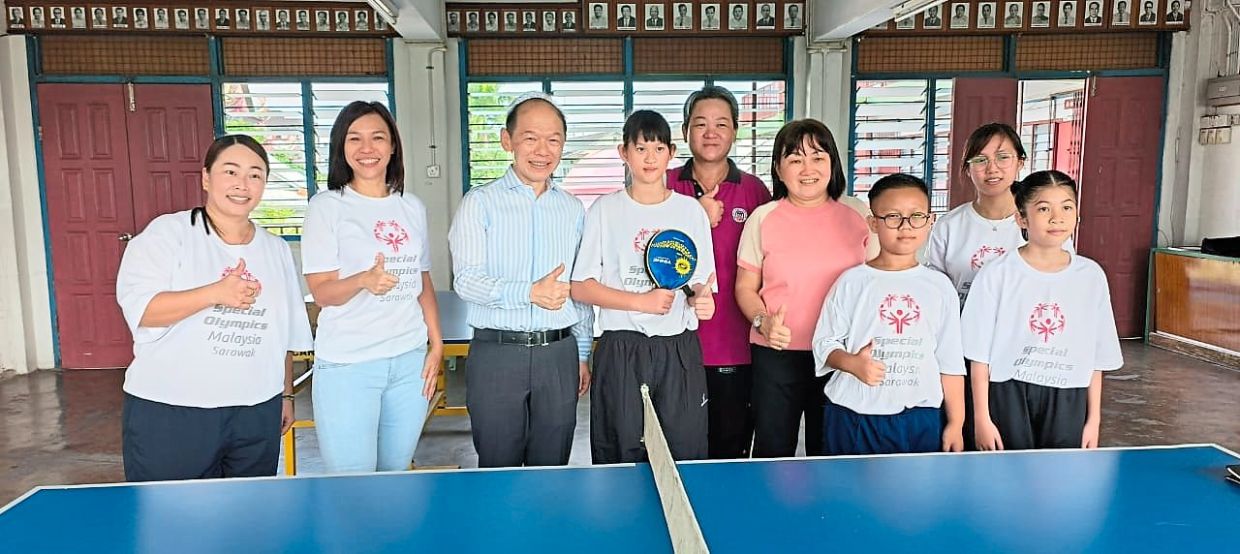Tai (second from left) and others wishing Tiong (third from left) success at the Special Olympics World Games 2023.