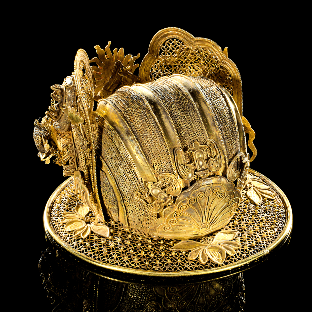A gold headdress from the Mengdiexuan collection on display at Gallery 9.