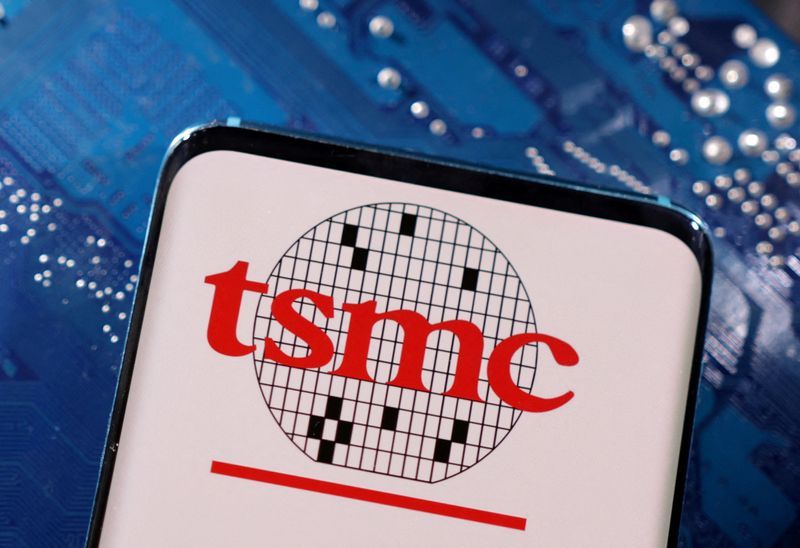 FILE PHOTO A smartphone with a displayed TSMC Taiwan Semiconductor Manufacturing Company  logo is placed on a computer motherboard in this illustration taken March 6 2023. REUTERSDado RuvicIllustrationFile Photo