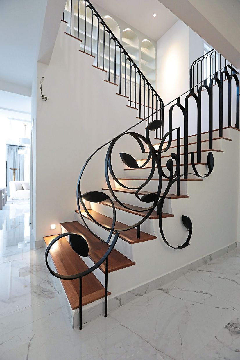 To elevate the limited space between the staircase and wall, Nik Ida created an elaborate 3D wrought iron balustrade staircase as a nod to the art deco period.