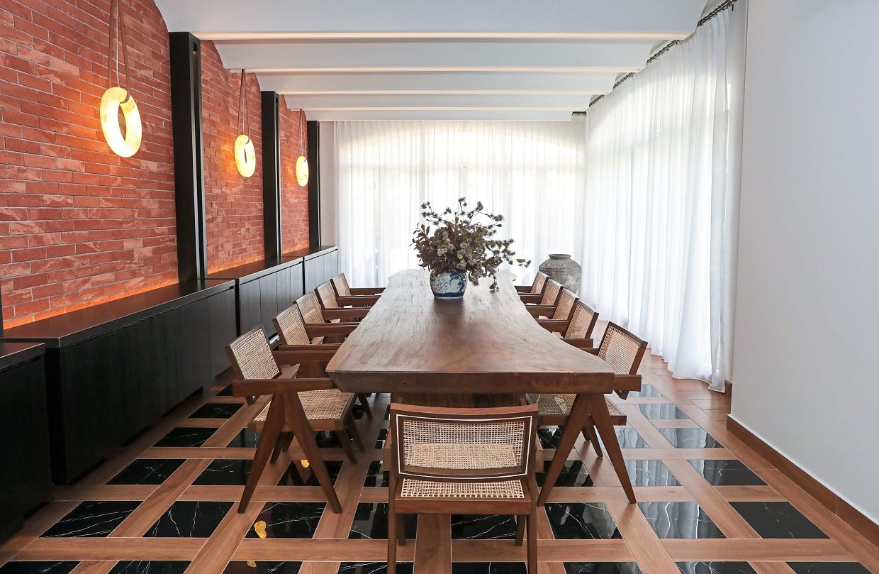 From the custom-built dining table to the home bar, the formal dining room is rooted in sleek sophistication and used for entertaining the homeowner’s family and friends.