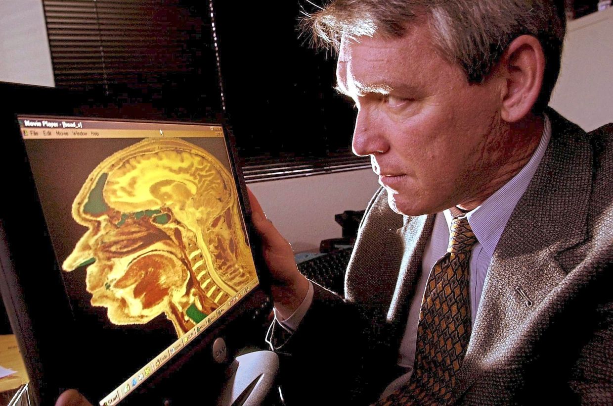 Bipolar disorder impacts various parts of the brain, including its gray matter and specific structures like the hippocampus. American psychiatrist Mark Rapaport is seen in this picture examining a digital MRI scan of the human brain. — Los Angeles Times