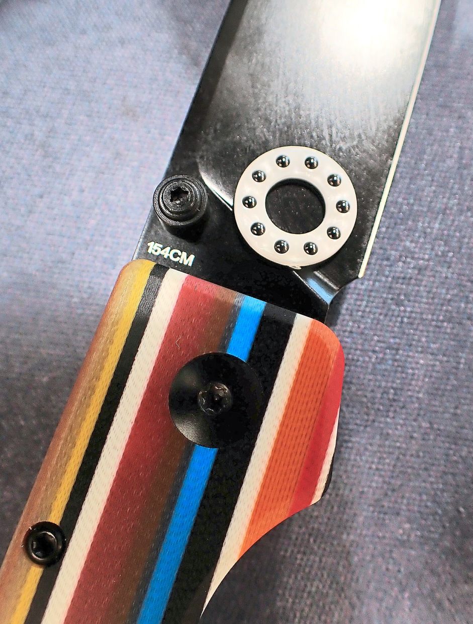 A folding knife’s ceramic ball bearings in a nylon polymer ring.