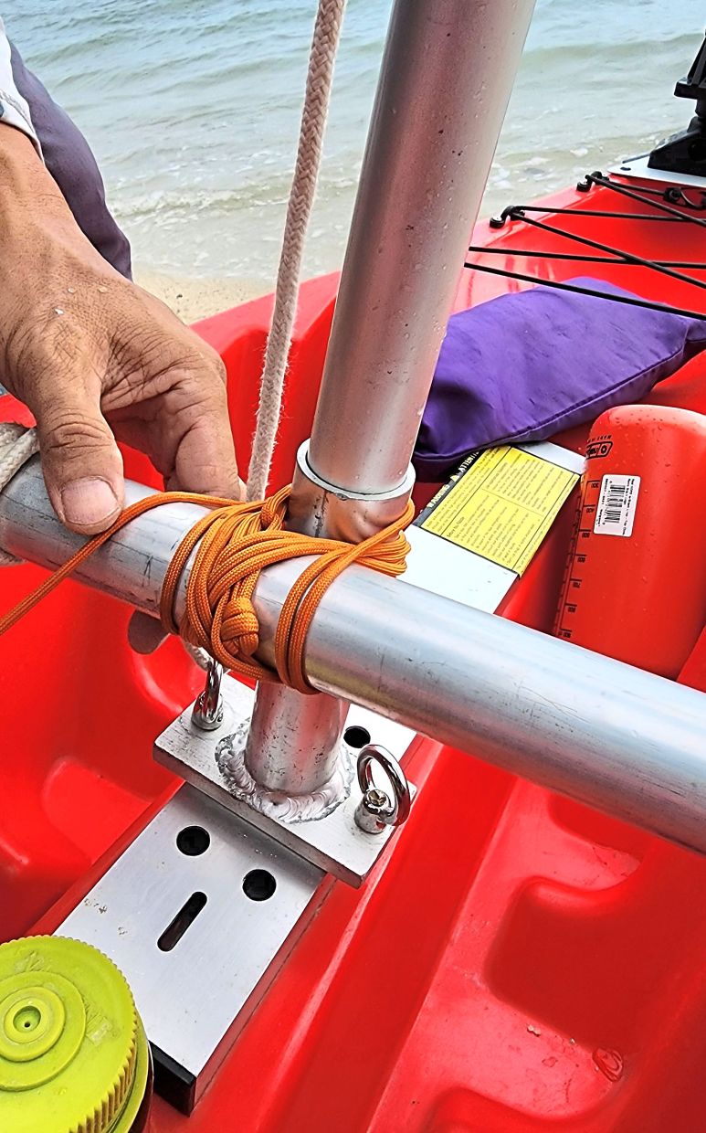 The strongest way to attach the stabilisers to the kayak and turn it into a trimaran is to lash them on with tough paracord.