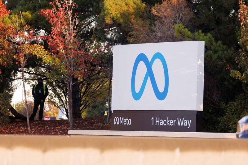 FILE PHOTO A security guard stands watch by the Meta sign outside the headquarters of Facebook parent company Meta Platforms Inc in Mountain View California U.S. November 9 2022.  REUTERSPeter DaSilvaFile Photo