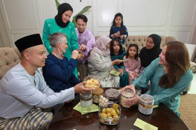 This Raya is especially meaningful for Kamarul Hasnan (left), a Malaysian living abroad, as he returns home after 28 years to celebrate the festivities with his family in Ipoh, Perak. — KAMARUL ARIFFIN/The Star