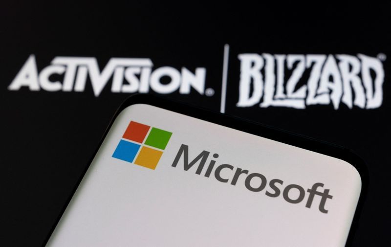 FILE PHOTO Microsoft logo is seen on a smartphone placed on displayed Activision Blizzard logo in this illustration taken January 18 2022. REUTERSDado RuvicIllustration