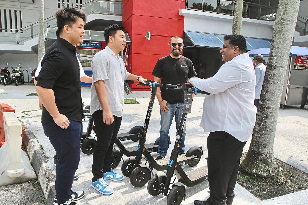 Rajiv (right) and Humayun (second from right) hope the escooter initiative will improve last-mile connectivity in Petaling Jaya.