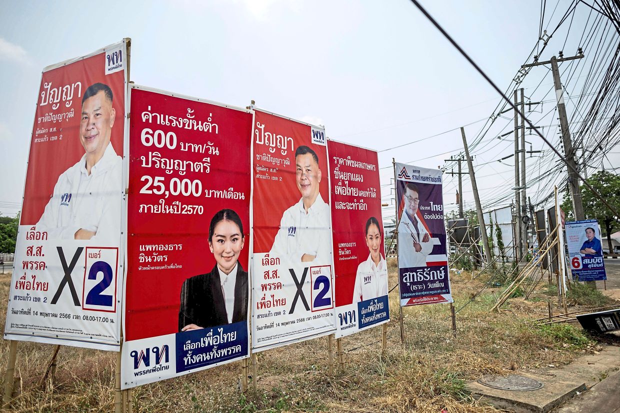 May the best win: Campaign posters for the upcoming general election are seen in Sa Kaeo. — AFP