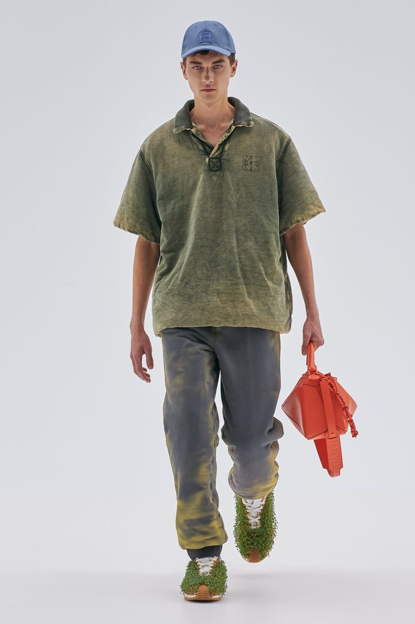 A blue baseball cap completes this outfit meant to look worn out fromLoewe’s Spring/Summer 2023 collection. Photo: Loewe