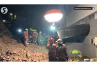 Landslide causes retaining wall to collapse, security guard killed