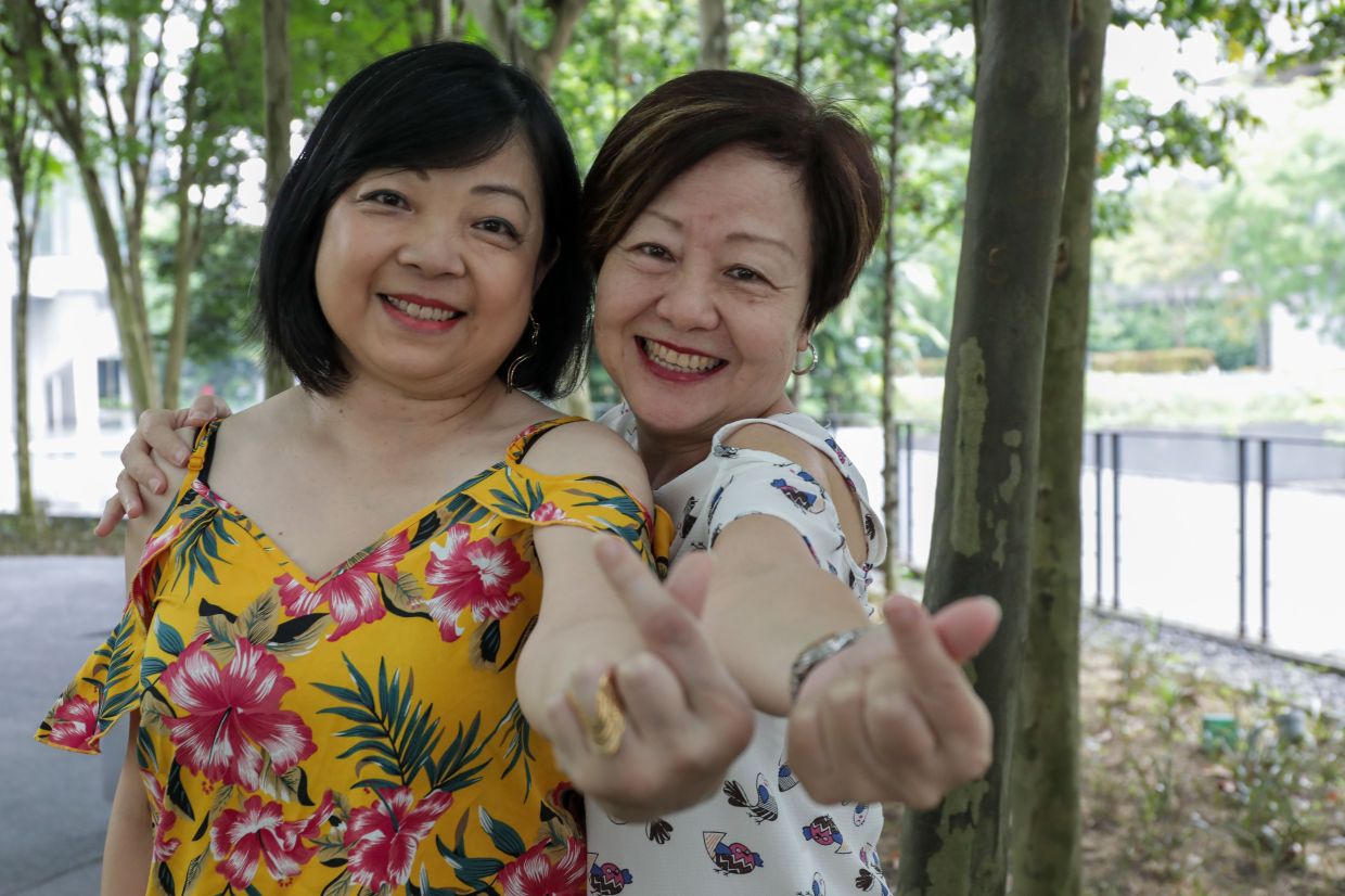 Law (left) and Pan went to the same school but they only became buddies when they both joined the choir in the 1980s and there's been no looking back since. — YAP CHEE HONG/The Star