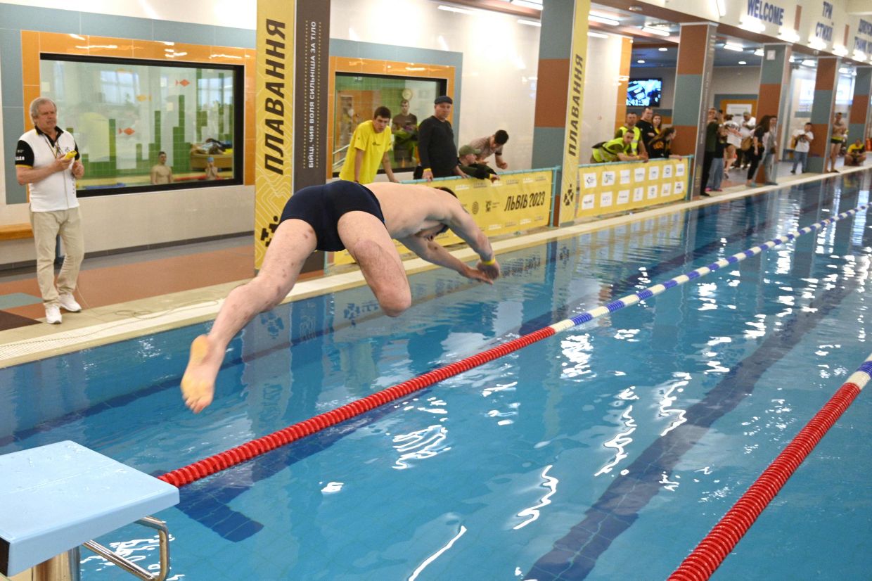 An athlete in action during a swimming event at the qualifying round of the Games. 