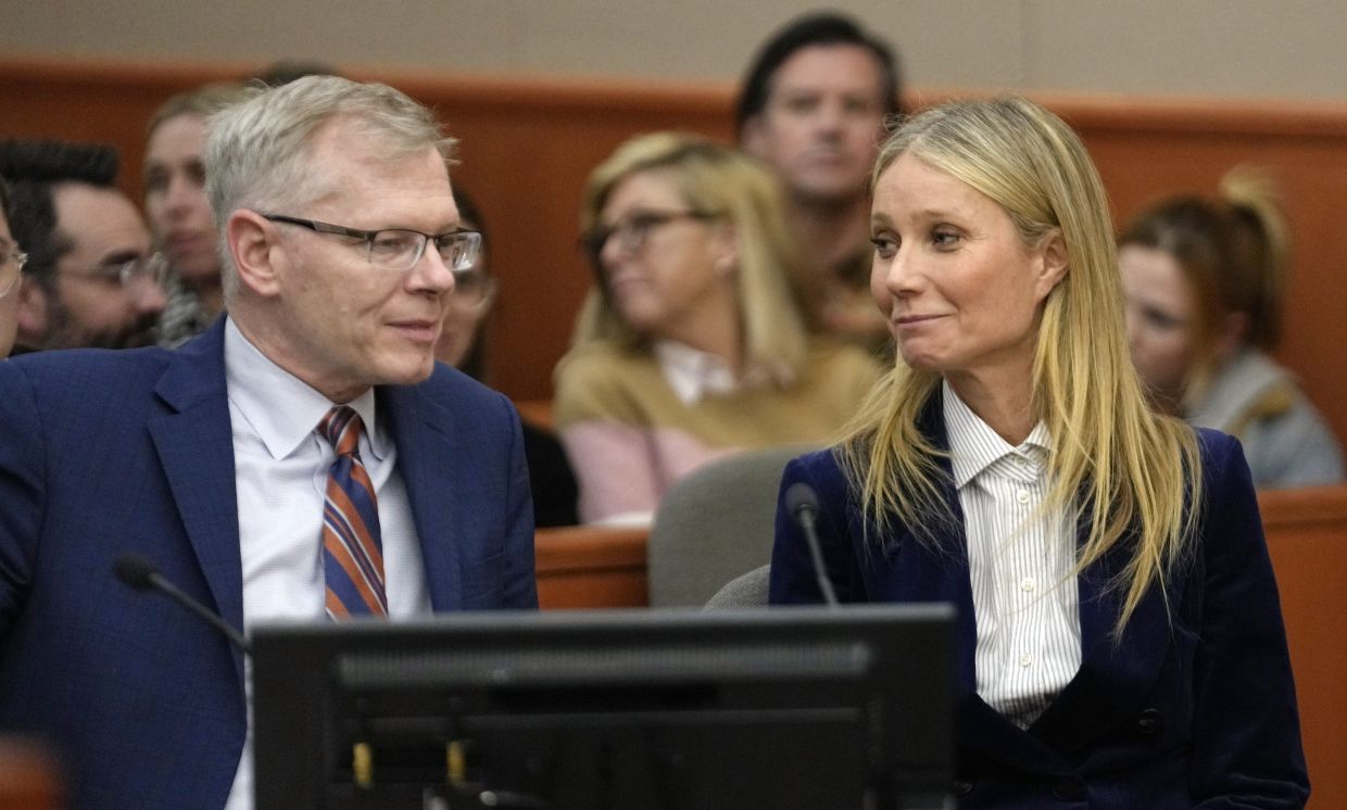 Gwyneth Paltrow and her attorney Steve Owens smile after the reading of the verdict in her lawsuit trial on March 30, 2023, in Park City, Utah. Photo: AP