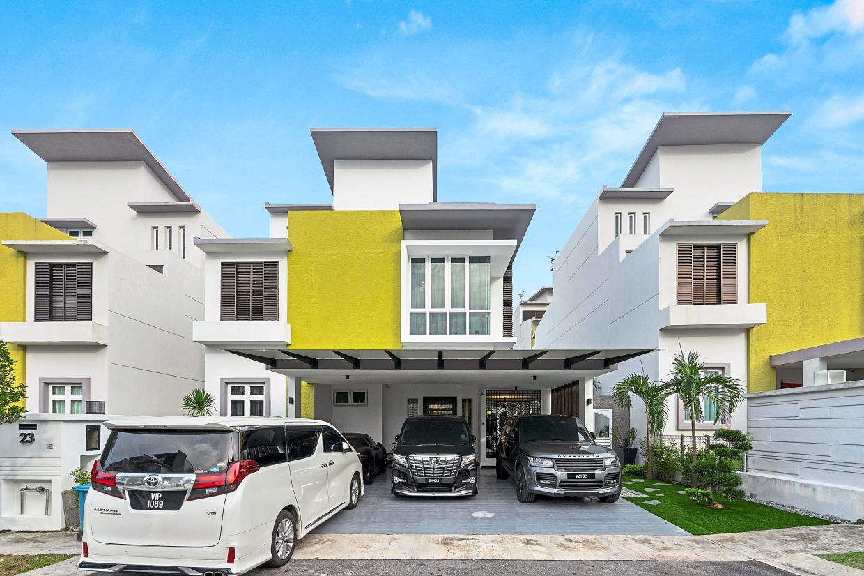 The three-storey, zero-lot bungalow was made over with rich textures, colourful furnishings and exuberant design.