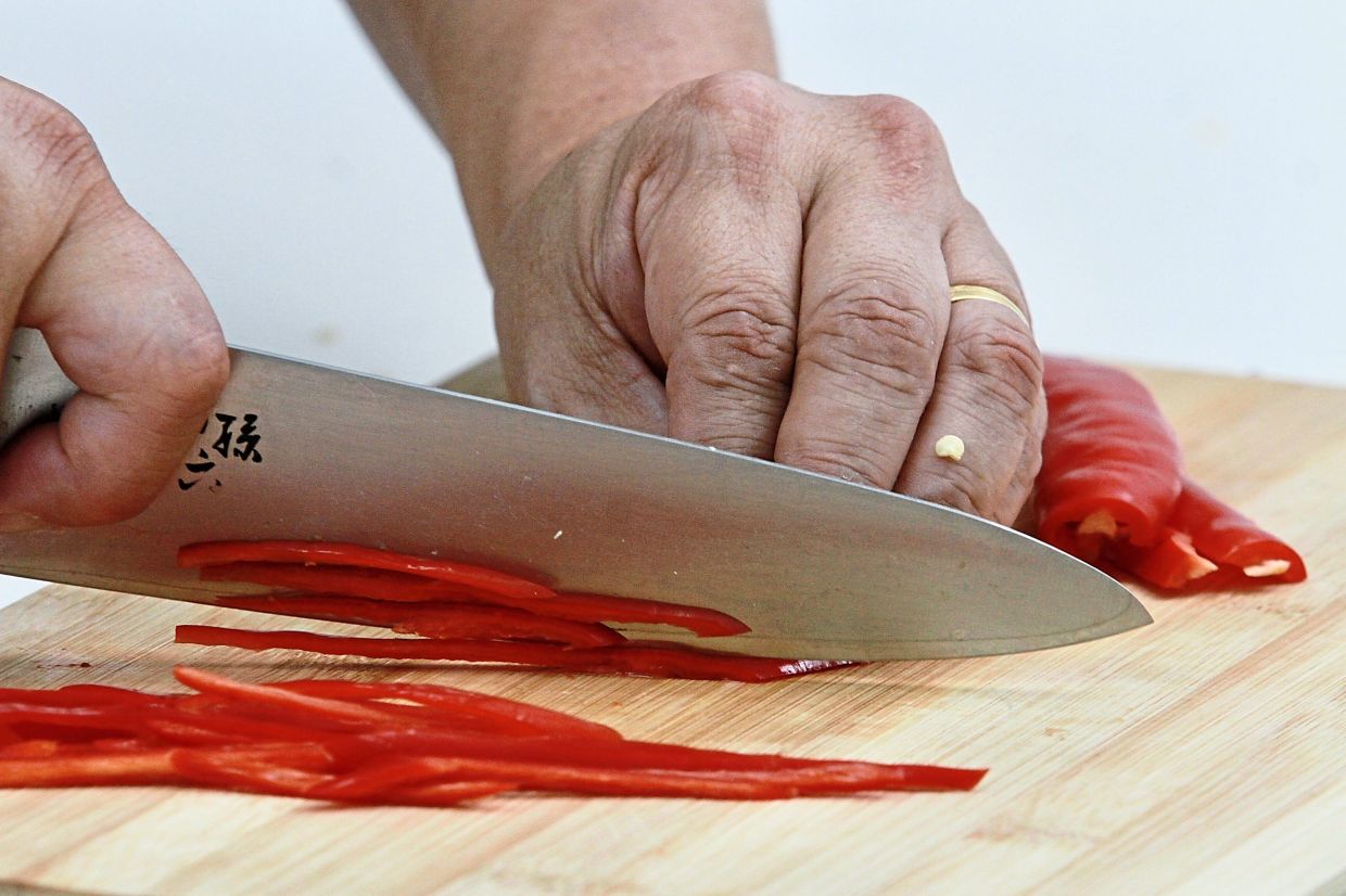 Remove stem and seeds from the chillies, then julienne into long thin strips.