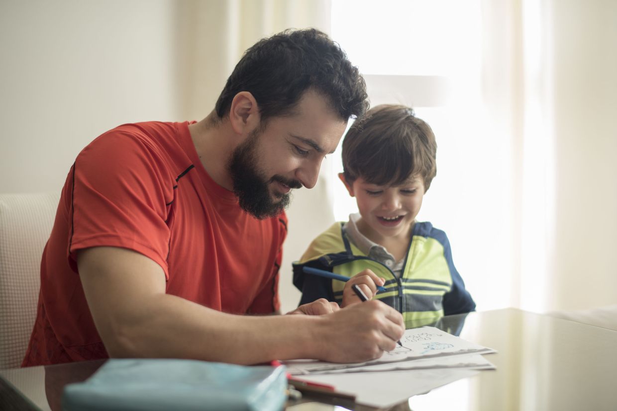 On top of helping their child with homework, helicopter parents often give correct answers for prevent mistakes. --123rf.com