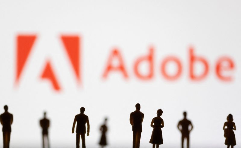 FILE PHOTO Figurines are seen in front of displayed Adobe logo in this illustration taken June 13 2022. REUTERSDado RuvicIllustration