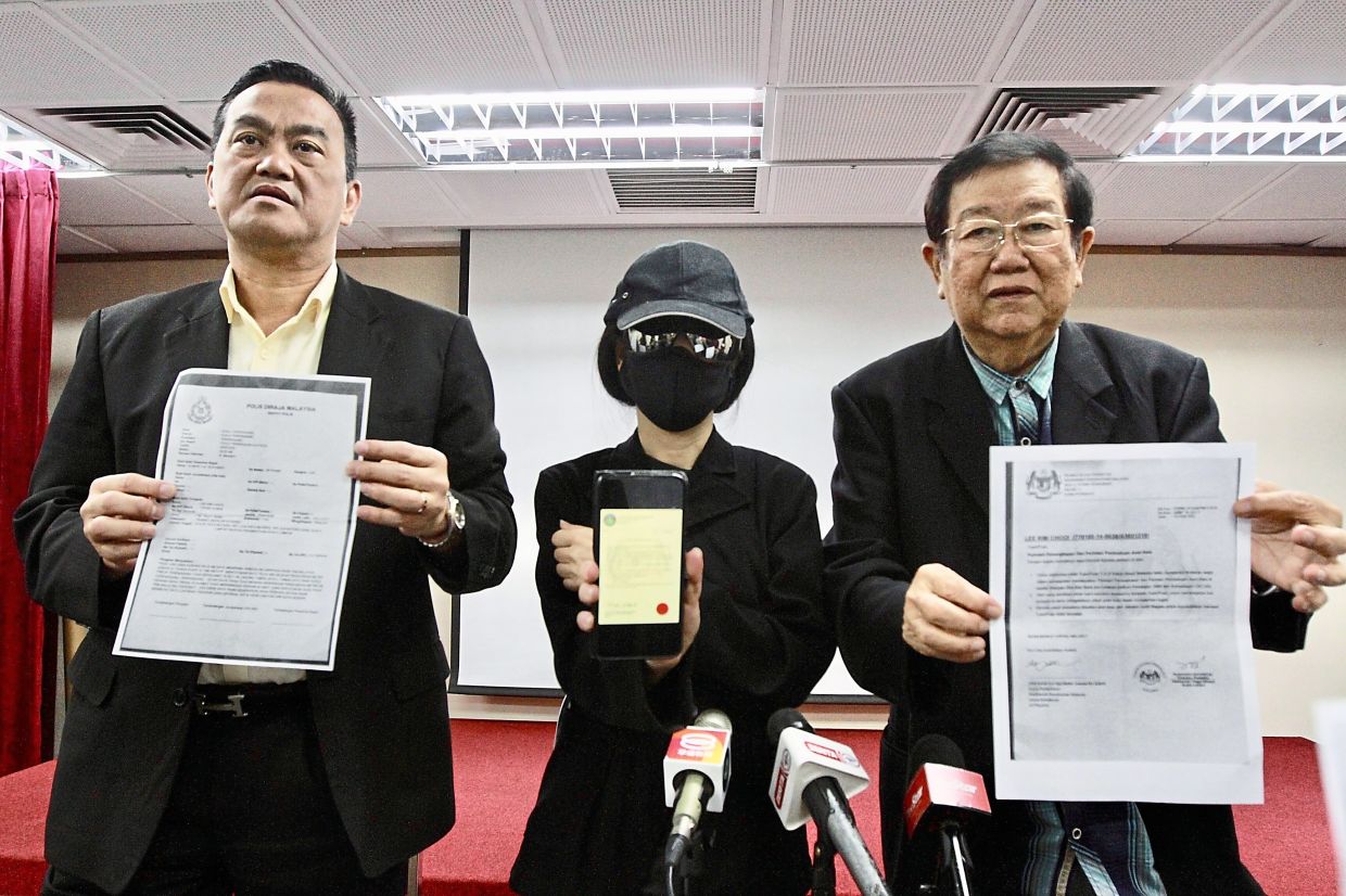 Public, beware: Chong (right) showing a copy of the letter the scammers used. With him is Datuk Seri Dr KK Chai and the victim. — LOW LAY PHON/The Star