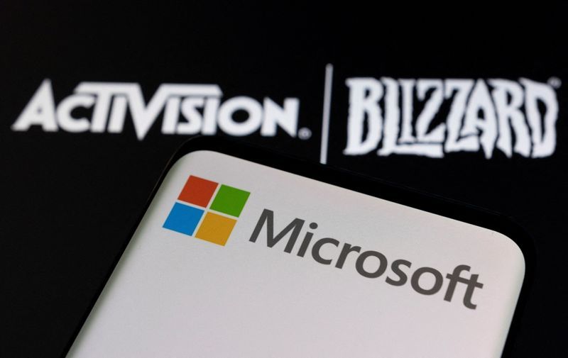 FILE PHOTO Microsoft logo is seen on a smartphone placed on displayed Activision Blizzard logo in this illustration taken January 18 2022. REUTERSDado RuvicIllustration