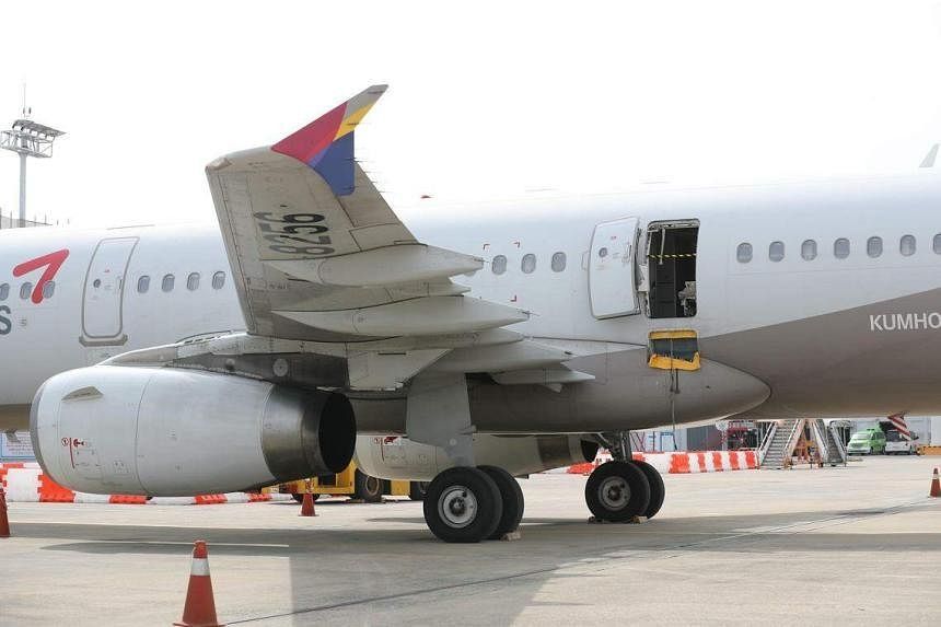 South Korea's Asiana Airlines bans sales of emergency seats after door