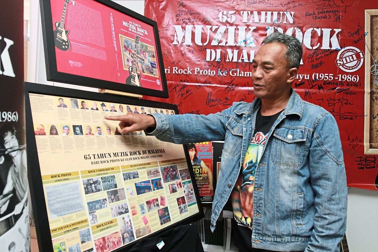 Muhamad Takiyuddin's book also contains a poster insert that maps out the rock scene in Malaysia through the key players and historic events. Photo: The Star/Low Lay Phon 