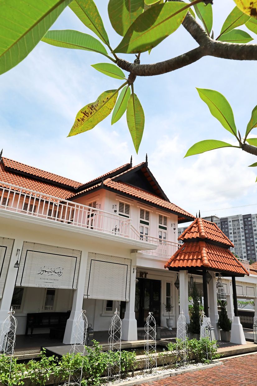 Rumah Teemor features the Limas Johor architectural style and contains original wooden materials from Faiz’s family home in Batu Pahat.