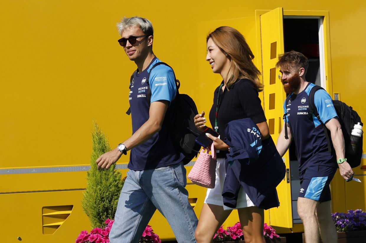 Williams driver Alexander Albon of Thailand arrives at the circuit before the third practice session for Sunday's Spanish F1 Grand Prix, at the Barcelona Catalunya racetrack in Montmelo, Spain, Saturday, June 3, 2023. - AP