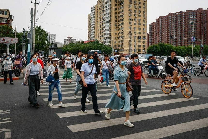 Amid fresh wave of Covid-19, workplaces in Beijing navigate infection etiquette - Vimarsana News