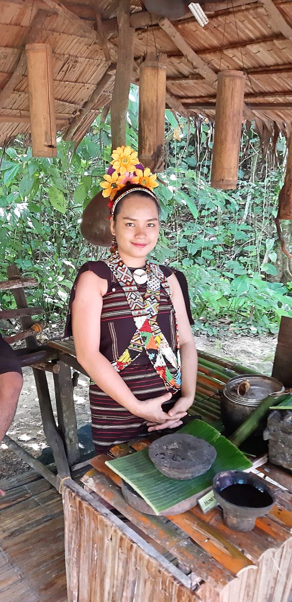 A Rungus lady dressed in her traditional attire.