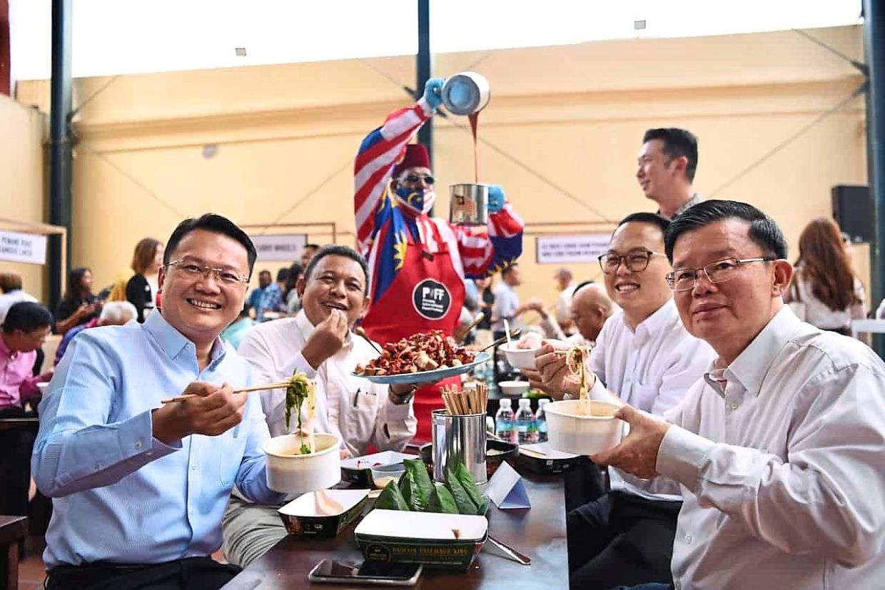 (From right, seated) Chow, Gooi, Azhar and Yeoh savouring local delights after the announcement of Penang International Food Festival 2023.