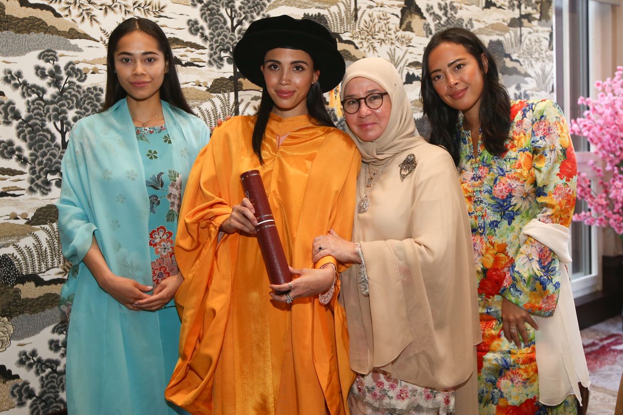 Her Majesty and Tengku Puteri Iman Afzan (third and second from left, respectively) being flanked by Tengku Puteri Ilyana (far left) and Tengku Puteri Ilisha Ameera (far right). - IZZRAFIQ ALIAS/The Star