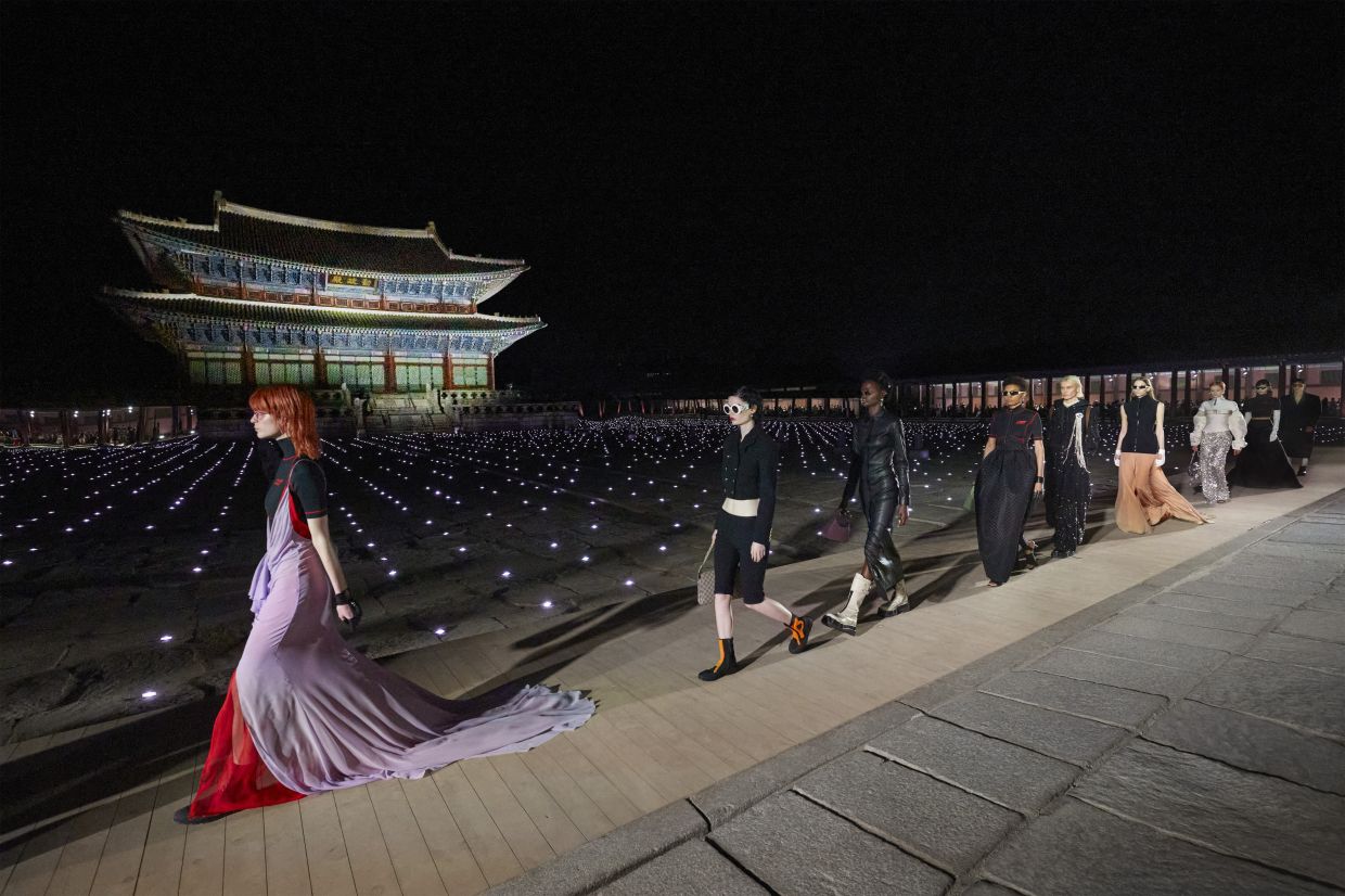 Gucci's show saw models walking the courtyard of a 14th-century palace in Seoul. Photo: Gucci
