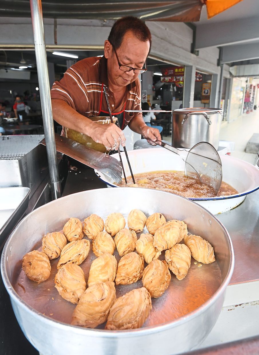 Chiam has been selling fried snacks at the same location for about 40 years.